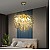 ثريا مودرن تصميم بلمسه ذهبي ه شفاف عسلي إضاءة راقيه E14*6L قطر 45 سم